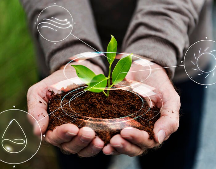 Smart agriculture IoT with hand planting tree background